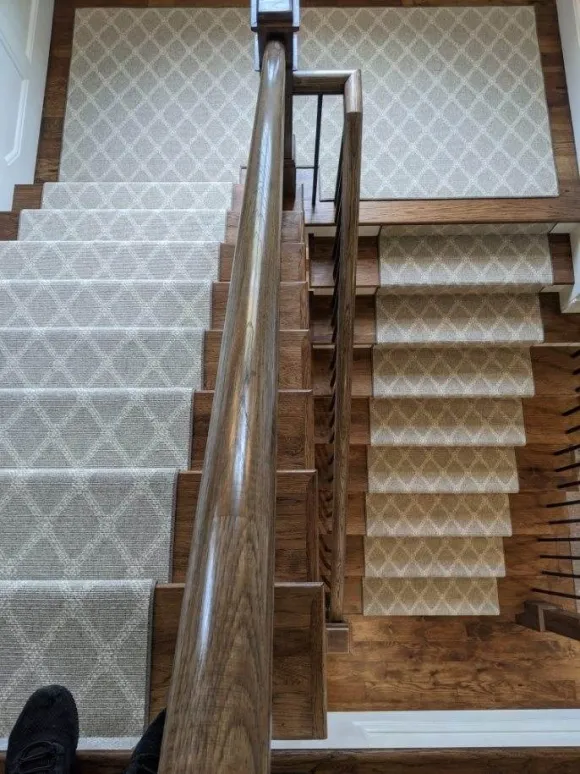 gray and white stair runner in diamond pattern